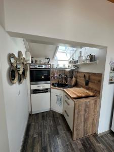 Kuchyň nebo kuchyňský kout v ubytování Heimat Apartment