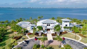 an aerial view of a house with the ocean in the background at One Happy Condo in Bradenton
