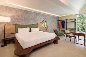 Ένα ή περισσότερα κρεβάτια σε δωμάτιο στο Treat Aranya Resort Kumbhalgarh