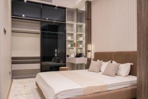 Postel nebo postele na pokoji v ubytování Nest One Downtown View, Элитные апартаменты с панорамным видом на город 207