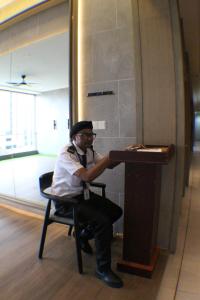 a man sitting in a chair at a desk at KLCC Pavilion Bukit Bintang Agile Hornbill Suites TRX in Kuala Lumpur +276 photos