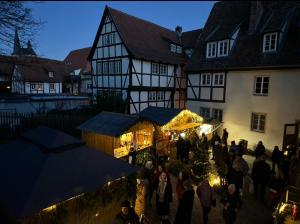 a crowd of people walking around a christmas market at Apartment In der Hohen in Quedlinburg