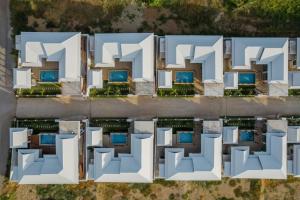an aerial view of a building with white architecture at ทองสุข Pool Villa 3 ห้องนอน in Ban Huai Thalaeng Phan