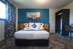 Cama o camas de una habitación en Hotel Le Belmont