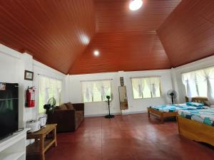 a large living room with a wooden ceiling at The Sylvia in San Juan