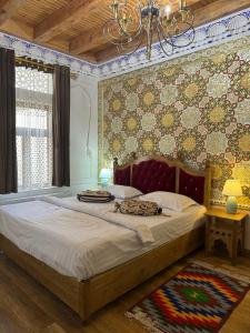 a bedroom with a large bed in a room at Asia Central Boutique in old city in Bukhara