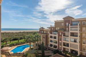 an aerial view of a resort with a swimming pool and the beach at Playa Grande - Playa Punta del Moral PPHG150P104 in Isla del Moral