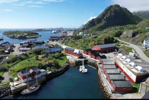 an aerial view of a harbor with boats in the water at KB - Nordic Luxury Rorbu in Stamsund
