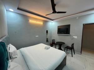 Μια τηλεόραση ή/και κέντρο ψυχαγωγίας στο Townhouse Preet Vihar Delhi