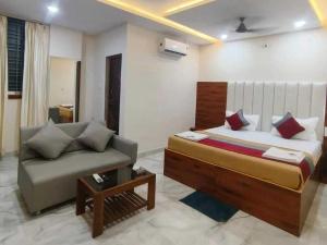 Katil atau katil-katil dalam bilik di POP 83949E Hotel Aditya Inn