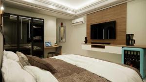 Katil atau katil-katil dalam bilik di POP 83949E Hotel Aditya Inn