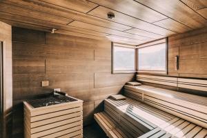 a room with two beds in a room with a window at Hotel SeeRose in Bodensdorf +71 photos