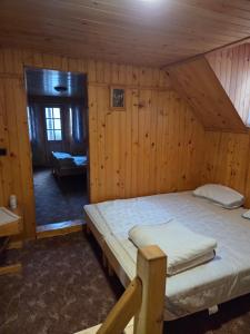 Postel nebo postele na pokoji v ubytování Cabana Montis River + 9 fotografií