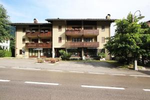 a large apartment building with balconies on a street at WI-RO Mavignola - Trekking & Ski in Madonna di Campiglio