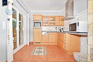 Kuchyň nebo kuchyňský kout v ubytování Ferienhaus Zirchow 1