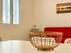 a dining room with a table and a red couch at Da Nonna Concetta - 5 minutes walk from the beach in Donnalucata +9 photos
