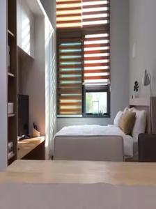 En eller flere senge i et værelse på City Center Duplex Room