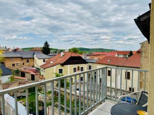a balcony with a view of a city at Silver Apartments in Kutná Hora