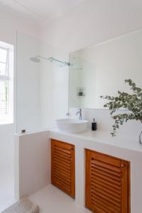 a bathroom with a sink and a mirror at Minserie Collection in Stellenbosch +161 photos