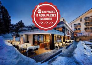 a restaurant with a sign that reads six passes and extra passes included at Hotel FIS in Štrbské Pleso
