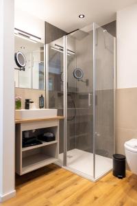 a bathroom with a shower and a sink at Hotel Motodrom in Hockenheim