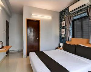 Postel nebo postele na pokoji v ubytování hotel Prime Plaza Newtown