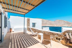 a villa with a view of the ocean at Panormos Art Villas & Suites in Panormos