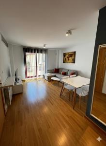 a living room with a couch and a table at Nido de Sabi in Pardinilla