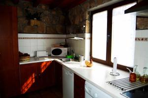 a kitchen with a sink and a window at Escápate y desconecta en Son Soles! in Blacha