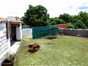 a garden with a horse statue in the grass at Escápate y desconecta en Son Soles! in Blacha +4 photos