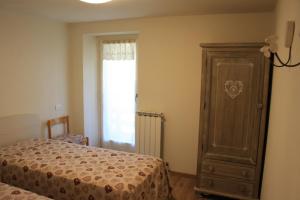 Postel nebo postele na pokoji v ubytování Sant'Orso Cozy Home