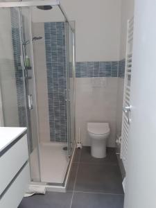 a white bathroom with a shower and a toilet at Casa Patavina in Padova