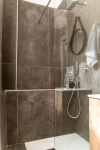 a shower with a glass door in a bathroom at AP Apartment B&B in Bagnoli Irpino