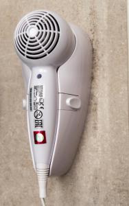 a hair dryer is attached to a wall at AP Apartment B&B in Bagnoli Irpino