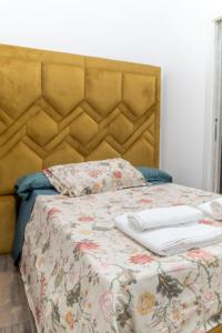 a bed with two towels on top of it at AP Apartment B&B in Bagnoli Irpino +52 photos