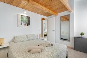 Ένα ή περισσότερα κρεβάτια σε δωμάτιο στο Torviscas Endless Summer +16 φωτογραφίες