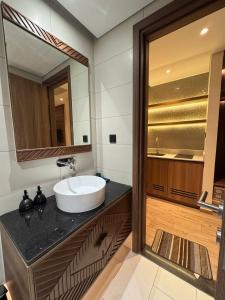 a bathroom with a sink and a mirror at Min Min Retreat in Phước Hậu