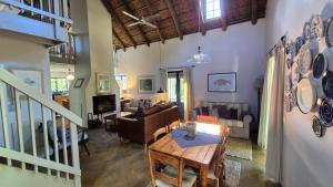 a living room with a couch and a table at Lavender’s Blue in Stanford