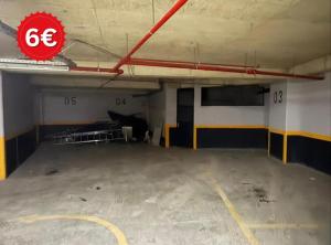 an empty parking lot in a parking garage at Hotel La Rosa in Tirane