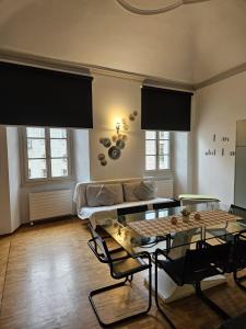 a living room with a couch and a table at Bellinzona Piazza Collegiata in Bellinzona +13 photos