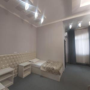 Voodi või voodid majutusasutuse Golden house hotel toas