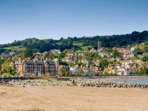 a view of a beach with a town in the background at 3 Bed in Watchet 37336 in Watchet