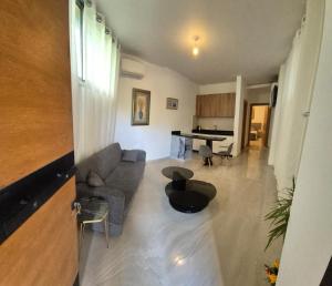 a living room with a couch and a table at Aley Pilot Residence in Aley