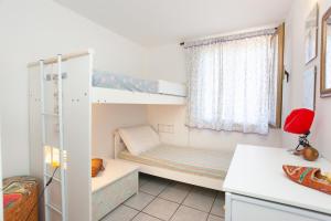 Postel nebo postele na pokoji v ubytování Casetta a due passi dal mare