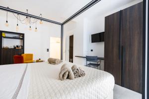 Postel nebo postele na pokoji v ubytování Gatto Matto