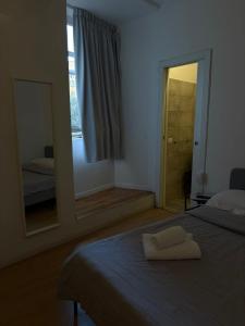 Ένα ή περισσότερα κρεβάτια σε δωμάτιο στο AH Suite Montecitorio