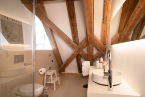 a bathroom with a glass shower and a toilet at Schloss Kirchberg - Schlossnest in Immenstaad am Bodensee +14 photos