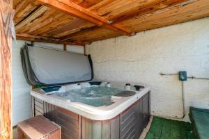 a large tub with a tv on top of it at Chalet gite in Saint-Paulet-de-Caisson +15 photos