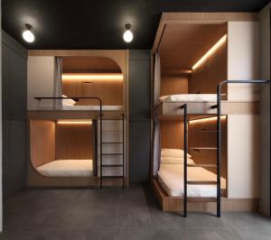 Ένα ή περισσότερα κρεβάτια σε δωμάτιο στο Miu Hostel