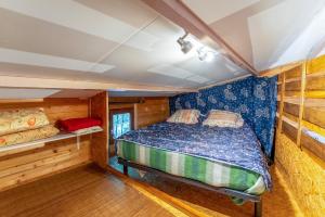 a bedroom in a cabin with a bed in it at Chalet gite in Saint-Paulet-de-Caisson